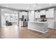 Modern kitchen with white cabinetry, stainless steel appliances, and an open layout at 17023 Adler Ln, Noblesville, IN 46060