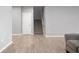 Open living room space with a staircase, neutral walls, and stylish flooring at 17023 Adler Ln, Noblesville, IN 46060