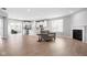 Spacious living room with fireplace and open layout, flowing into a modern kitchen at 17023 Adler Ln, Noblesville, IN 46060