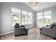Sunroom area with lots of natural light, hardwood floors and view to lake at 17023 Adler Ln, Noblesville, IN 46060