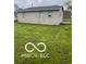 Expansive backyard with lush green grass, offering ample space for outdoor activities and relaxation at 1710 S Birch St, Muncie, IN 47302
