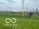 View of the community baseball field and fencing on a cloudy day at 1710 S Birch St, Muncie, IN 47302