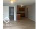 Open-concept living space with hardwood floors and neutral walls at 1710 S Birch St, Muncie, IN 47302