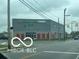 View of a single story modern commercial storage building with red accents at 1710 S Birch St, Muncie, IN 47302