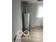 This utility room showcases a modern water heater with efficient connections and updated flooring at 1710 S Birch St, Muncie, IN 47302