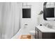 Bright bathroom featuring a shower-tub combo, modern vanity, and stylish decor at 1715 Haynes Ave, Indianapolis, IN 46240