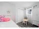 A bedroom with a single bed, a unicorn decal on the wall, and a play table at 1715 Haynes Ave, Indianapolis, IN 46240