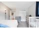 Neutral bedroom with a crib, dresser and large closet at 1715 Haynes Ave, Indianapolis, IN 46240