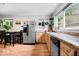Kitchen featuring stainless steel refrigerator, wood-look flooring, and lots of natural light at 1715 Haynes Ave, Indianapolis, IN 46240
