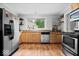 Bright kitchen with stainless steel appliances, plenty of counter space, and a window view at 1715 Haynes Ave, Indianapolis, IN 46240