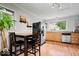 Kitchen with stainless steel appliances, wooden table, and open layout at 1715 Haynes Ave, Indianapolis, IN 46240