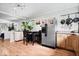 Spacious kitchen with stainless steel appliances, wood-look flooring, and decorative lighting at 1715 Haynes Ave, Indianapolis, IN 46240
