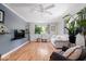 Bright living room with hardwood floors, a ceiling fan, and lots of natural light at 1715 Haynes Ave, Indianapolis, IN 46240