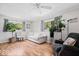 Cozy living room featuring hardwood floors, neutral furniture, and plenty of natural light at 1715 Haynes Ave, Indianapolis, IN 46240