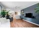 Open-concept living room featuring hardwood floors and modern decor at 1715 Haynes Ave, Indianapolis, IN 46240