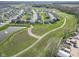 Well-planned community featuring modern homes, walking trails, and a central pond at 17344 Hanningfield Way, Westfield, IN 46074