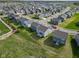 Aerial view of neighborhood with sidewalks, landscaped yards, and community spaces at 17344 Hanningfield Way, Westfield, IN 46074