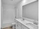 Bathroom with a double sink vanity, quartz countertop and a shower-tub combination at 17344 Hanningfield Way, Westfield, IN 46074