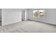 Bedroom featuring carpet floors, white walls, and a large window at 17344 Hanningfield Way, Westfield, IN 46074