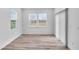 Bright, minimalist bedroom with lots of natural light and vinyl floors at 17344 Hanningfield Way, Westfield, IN 46074
