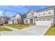 Charming new construction homes featuring attractive gray siding and attached two car garage at 17344 Hanningfield Way, Westfield, IN 46074