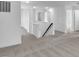 Upstairs hallway featuring carpet floors, white walls, and multiple doors at 17344 Hanningfield Way, Westfield, IN 46074