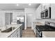 A well-appointed kitchen features stainless steel appliances, granite countertops and a pantry at 17344 Hanningfield Way, Westfield, IN 46074