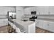 Modern kitchen with granite countertops, stainless steel appliances, and an island with barstool seating at 17344 Hanningfield Way, Westfield, IN 46074