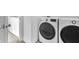 Modern laundry room featuring a LG washer and dryer with smart technology at 17344 Hanningfield Way, Westfield, IN 46074