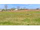 Expansive green space with blue skies, ready for development or recreation at 17344 Hanningfield Way, Westfield, IN 46074