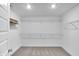 Spacious walk-in closet with carpet and wire shelving for ample storage solutions at 17344 Hanningfield Way, Westfield, IN 46074