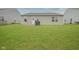 Spacious backyard with lush green grass, a back patio and ample space for outdoor activities at 1739 Elderberry Dr, Indianapolis, IN 46234