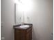 Well-lit bathroom vanity area with a sink, mirror, and essential fixtures at 1739 Elderberry Dr, Indianapolis, IN 46234