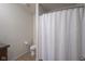 Functional bathroom featuring a shower with a white curtain, and essential fixtures at 1739 Elderberry Dr, Indianapolis, IN 46234