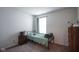 Cozy bedroom showcasing a twin bed, side table, and ample natural light from the window at 1739 Elderberry Dr, Indianapolis, IN 46234