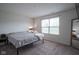 Bright bedroom featuring a large window, neutral decor, and ample natural light at 1739 Elderberry Dr, Indianapolis, IN 46234