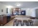 Kitchen with island, black appliances, tile flooring and wooden cabinets at 1739 Elderberry Dr, Indianapolis, IN 46234
