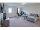 Cozy living room with a plush sectional sofa, perfect for relaxing and entertaining guests at 1739 Elderberry Dr, Indianapolis, IN 46234