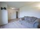 Living room featuring carpet, a sofa and access to other areas of the home at 1739 Elderberry Dr, Indianapolis, IN 46234