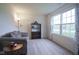 Cozy living room with carpet, large window, and comfortable sofa at 1739 Elderberry Dr, Indianapolis, IN 46234