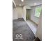 Finished basement with carpeted floors, white walls, and window for natural light at 1945 Plantation Ln, Martinsville, IN 46151