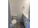Bright bathroom featuring a toilet and modern white vanity with ample storage space at 1945 Plantation Ln, Martinsville, IN 46151