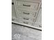 Close up of the white bathroom vanity featuring shaker drawers and cabinet doors and sleek, dark hardware at 1945 Plantation Ln, Martinsville, IN 46151