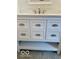 Close-up showcases white bathroom vanity with shaker-style drawers and brushed nickel hardware at 1945 Plantation Ln, Martinsville, IN 46151
