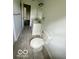 Bathroom featuring double vanity, toilet, modern fixtures and natural light at 1945 Plantation Ln, Martinsville, IN 46151