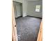 Bedroom with a window, a built-in shelving unit, and plush gray carpeting at 1945 Plantation Ln, Martinsville, IN 46151