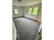 Bedroom with three windows and plush gray carpeting at 1945 Plantation Ln, Martinsville, IN 46151