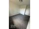 Bedroom with two doors, gray carpet, and a ceiling light fixture at 1945 Plantation Ln, Martinsville, IN 46151