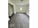 Bedroom featuring a closet, window, and gray carpeting at 1945 Plantation Ln, Martinsville, IN 46151