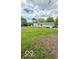 View of the home featuring large backyard and new deck at 1945 Plantation Ln, Martinsville, IN 46151